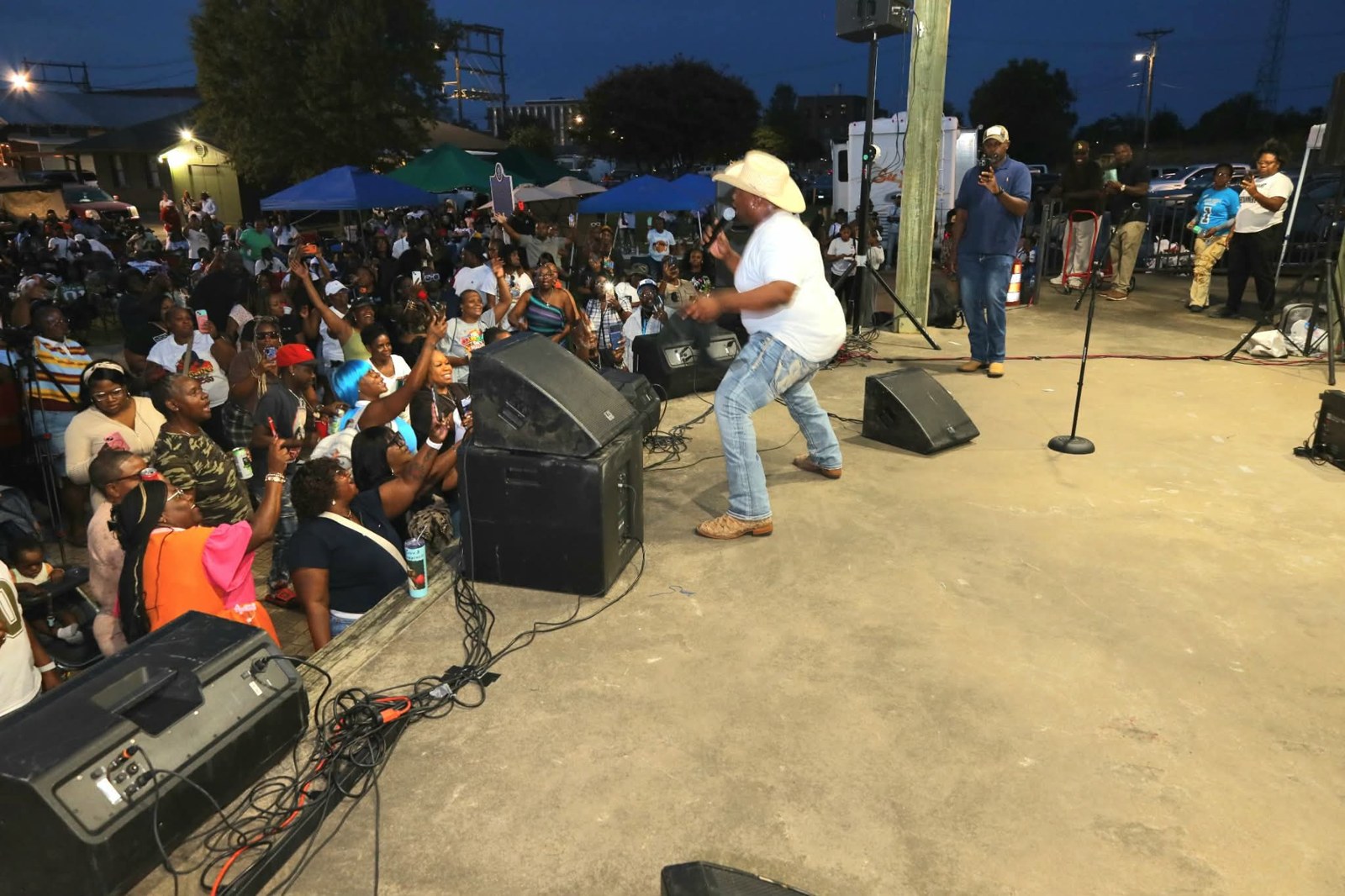 Live music and a crowd enjoying a community celebration